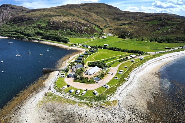 Aerial view of Ardmair Holiday Park, otherwise known as Ardmair campsite. Just a few miles north of Ullapool, space for tents, campervans, caravans with some services. Sits on the beach with great views