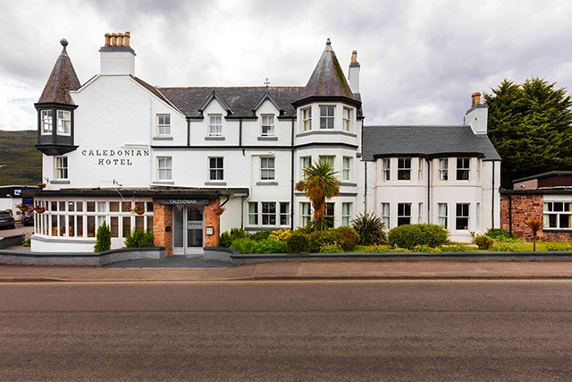 Caledonian Hotel in Ullapool. The front entrance to the hotel. There is also a restaurant, bar and pub as well as being used for functions like weddings. Based in the Highlands of Scotland